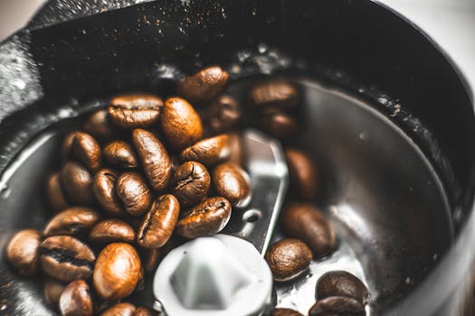 Coffee beans are being ground in a coffee grinder